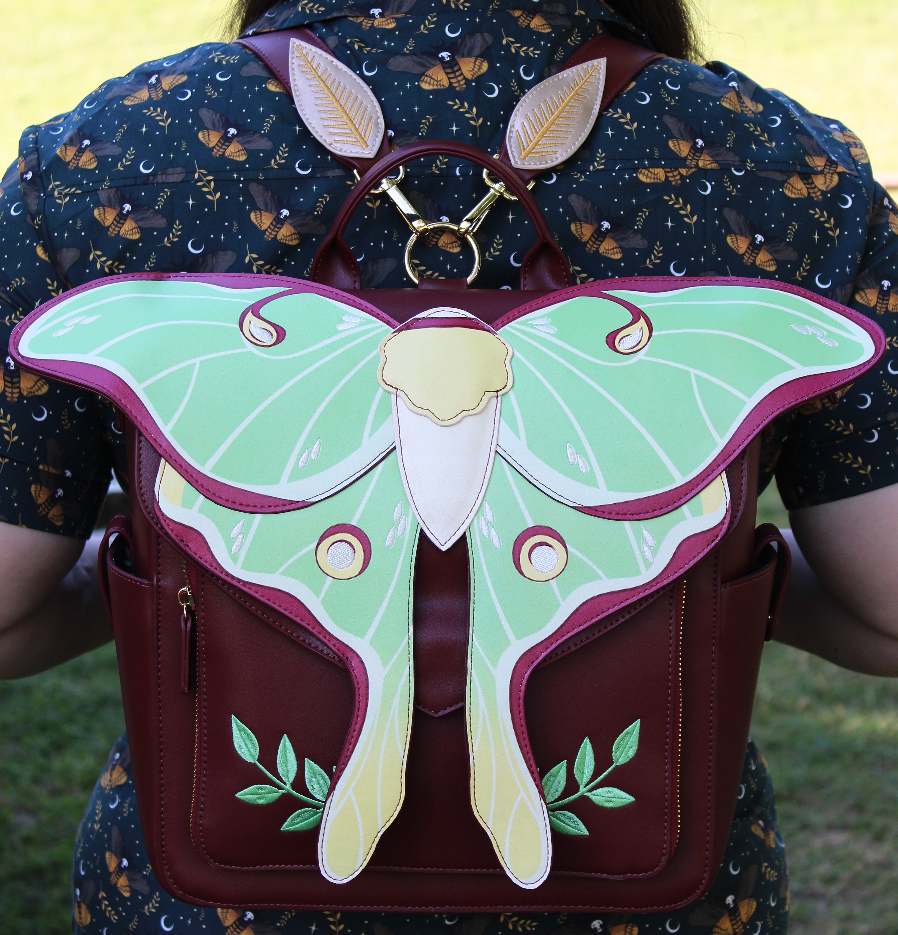 Backpack with a large moth design on the back