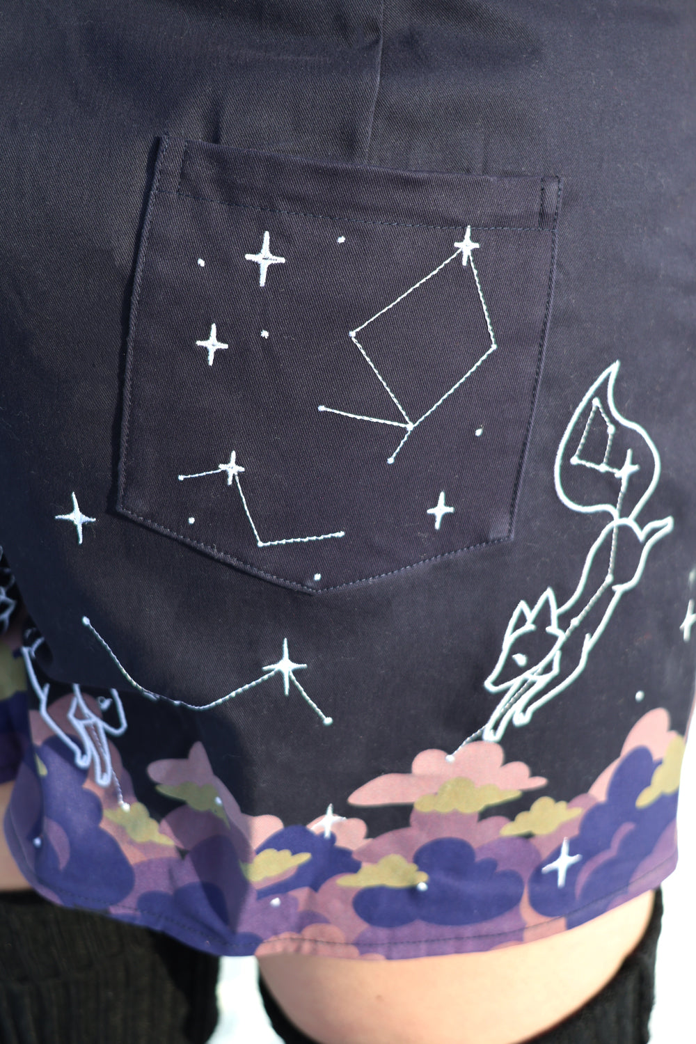 Pocket and constellation print detail on fantasy-inspired Astral Dream overalls