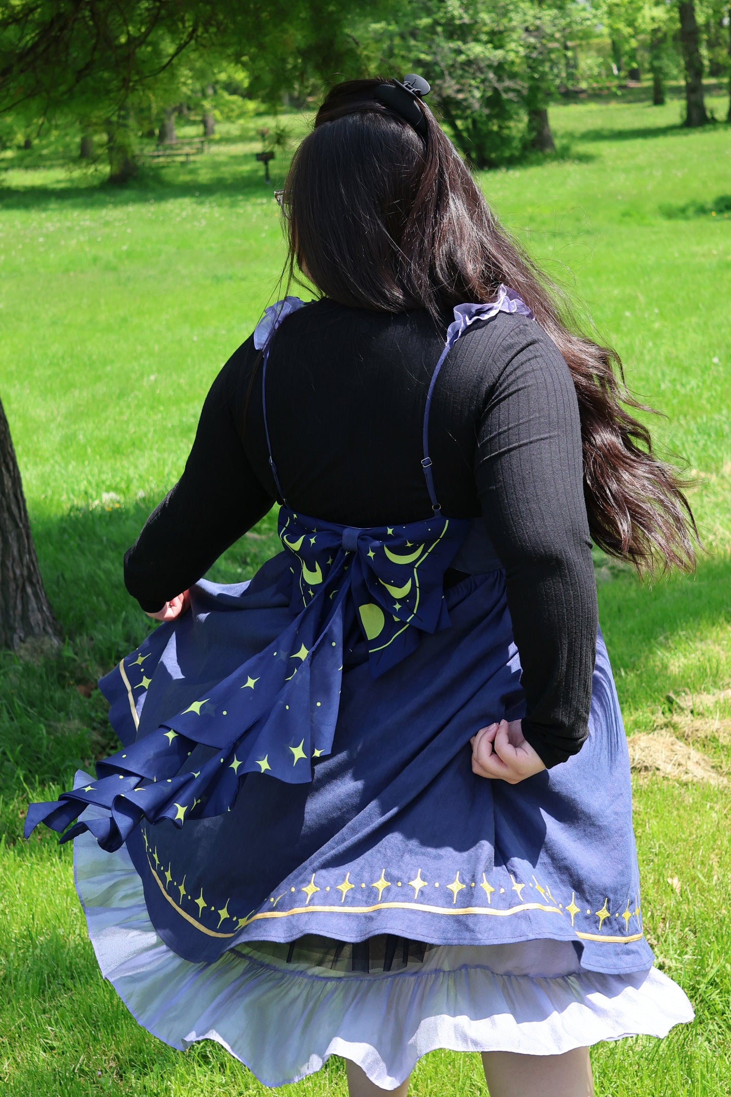 Cosmic moth dress inspired by celestial fashion, magical girl aesthetics, and whimsical fairycore style with a decorative moon and stars bow.