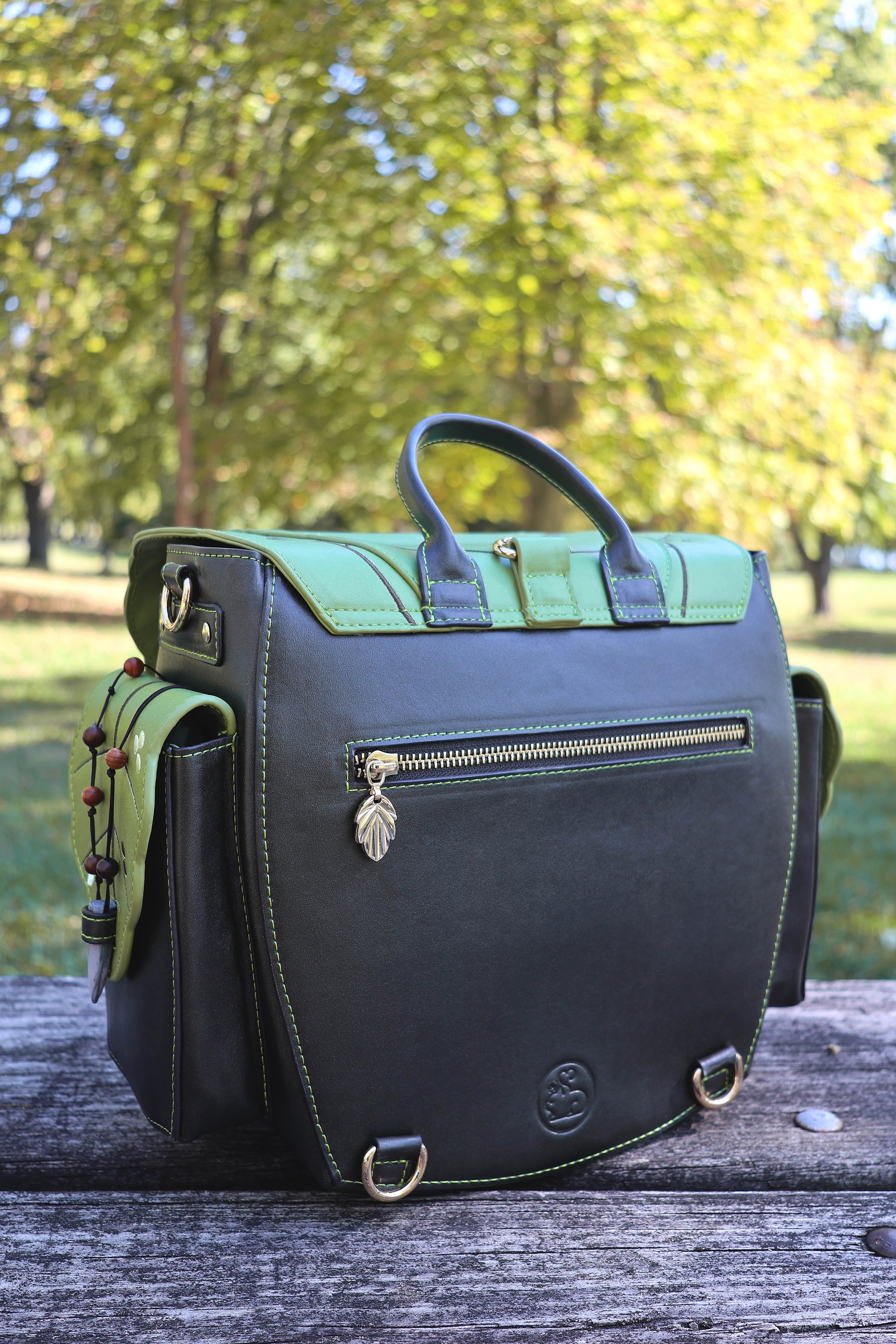 Green and dark brown bag on a wooden surface with a blurred natural background