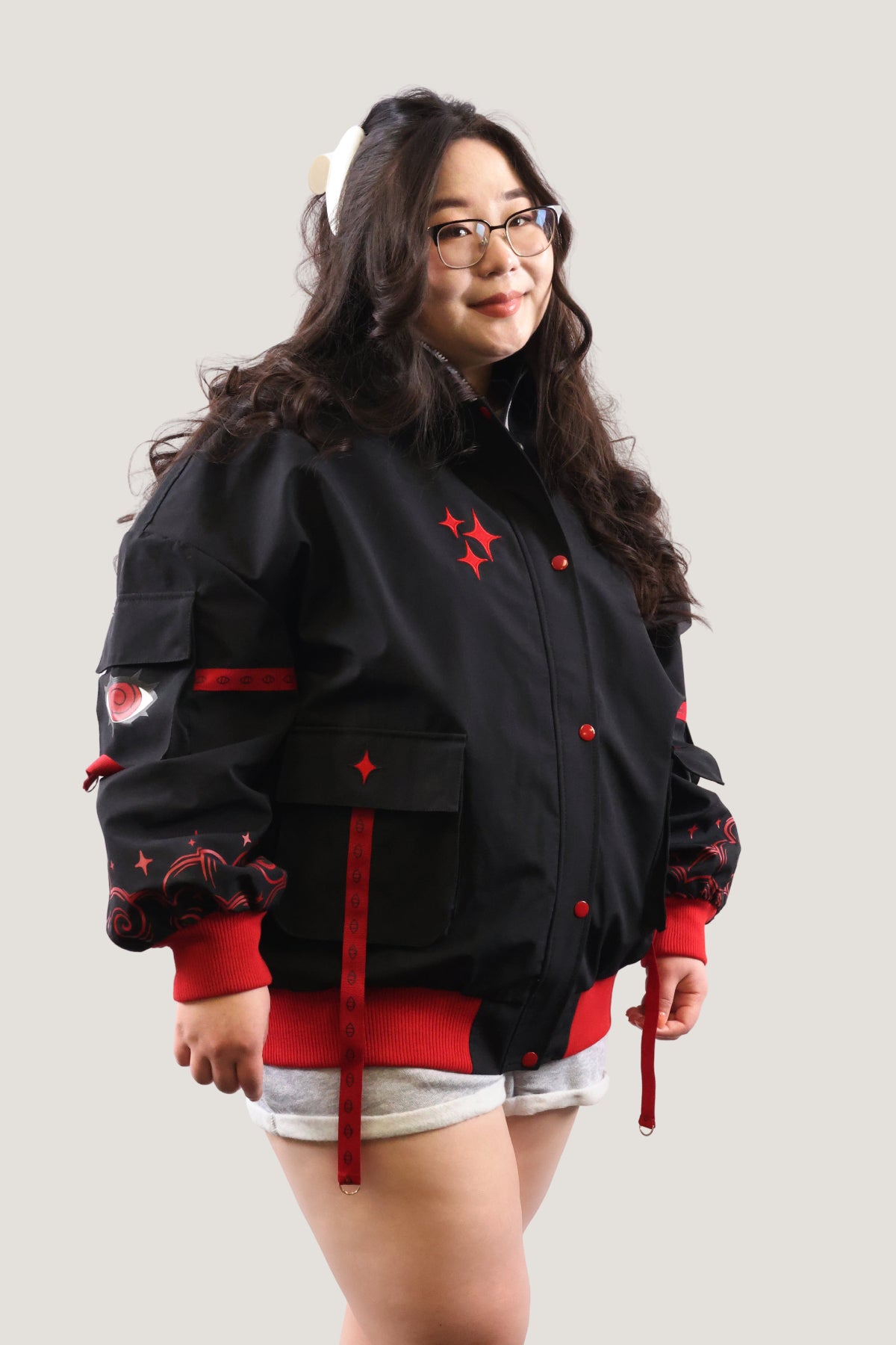 Detailed front view of the Fallen Angel bomber jacket with red and white star accents.