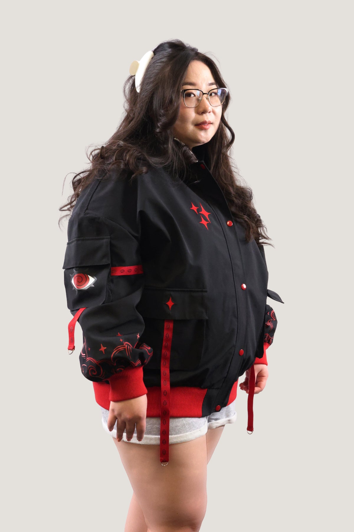 Detailed front view of the Fallen Angel bomber jacket with red and white star accents.