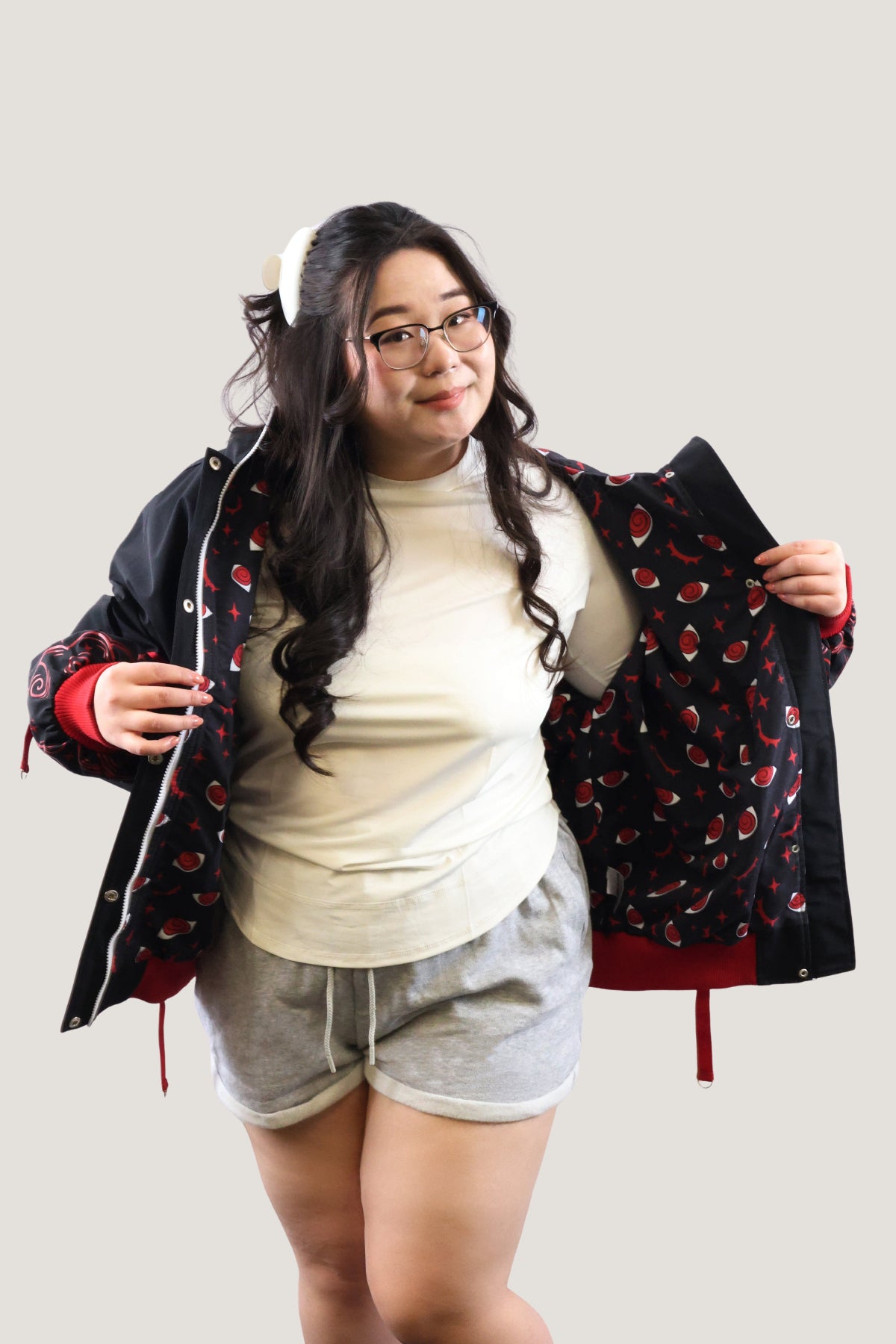 Front view of the Fallen Angel jacket held open to reveal a custom black lining with red eye and star patterns.