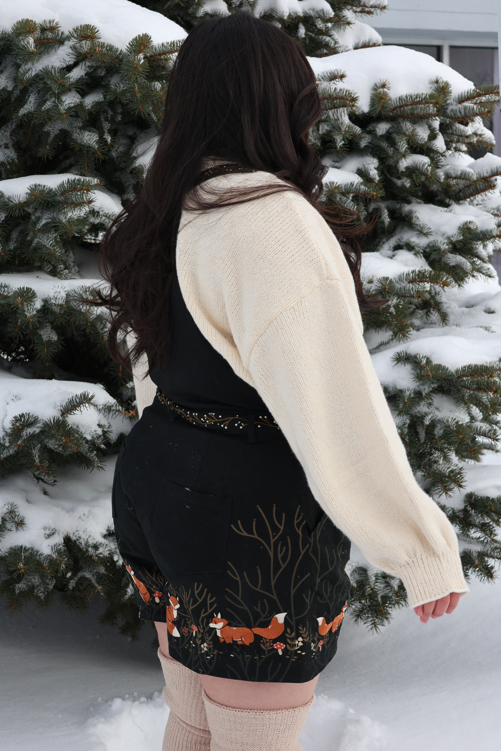 Side view of Forest Tale forestcore overalls with fox and woodland artwork