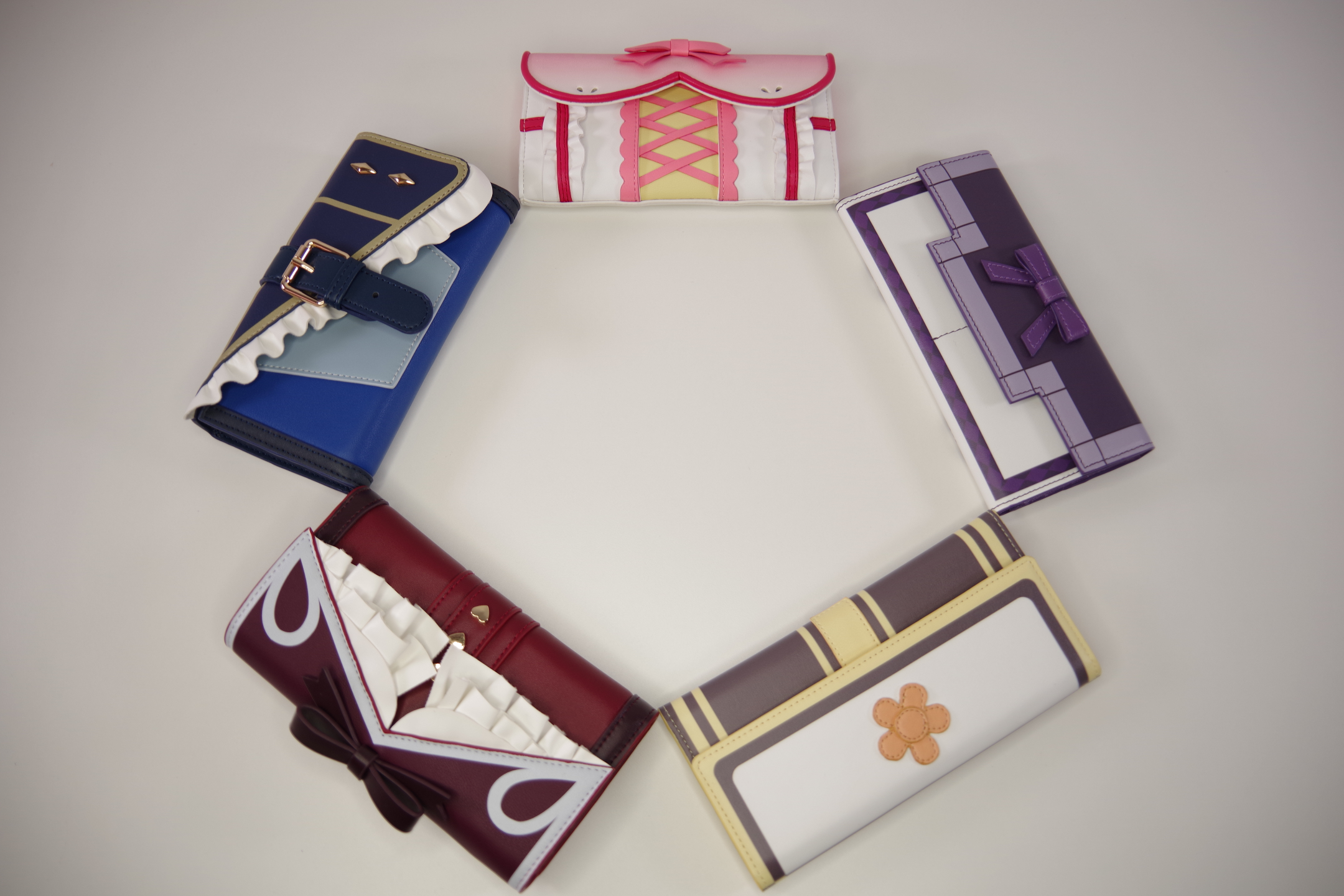 Magical girl inspired wallet collection featuring kawaii bows, ruffles, corset details, and fantasy anime fashion aesthetics.