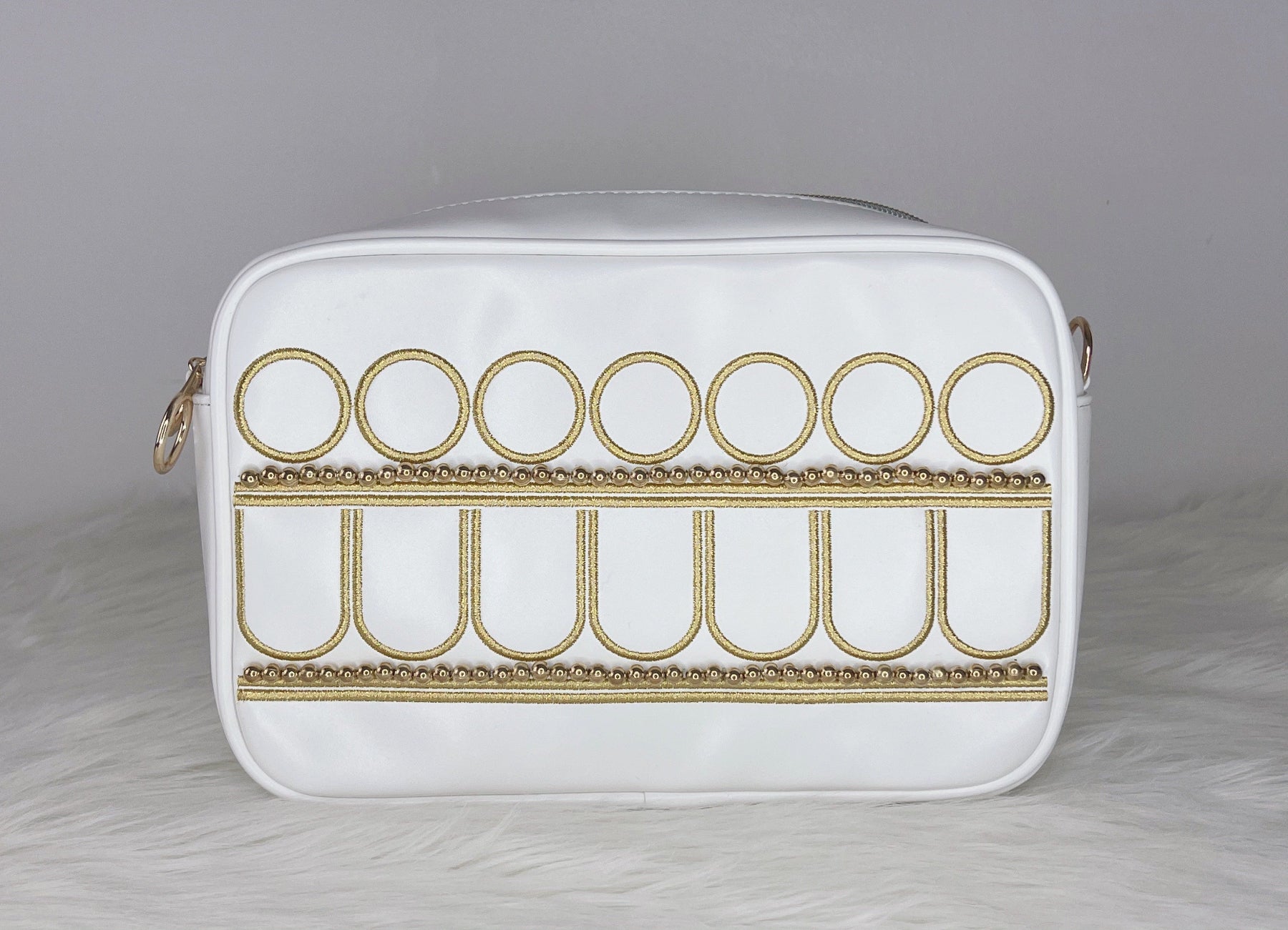Serenity-inspired celestial purse featuring white faux leather, gold embroidery, and a moon princess aesthetic.